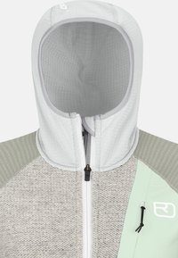 Light gray jacket featuring a textured hood, contrasting green side panel, and a zipper with black hardware. Material is soft knit with smooth accents.