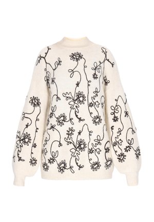 Gebreide pullover trui in crème met donkere bloemenborduursels, voorzien van een hoge halslijn en oversized ballonmouwen. Zachte textuur, ontspannen pasvorm.