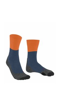 Calze lunghe con un risvolto arancione a coste, corpo blu e punte e talloni rinforzati grigi. Progettate con una suola imbottita per il comfort.
