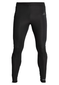 Leggings sportivi neri realizzati in materiale elasticizzato, caratterizzati da un design aderente, silhouette snella e un logo discreto sulla vita.