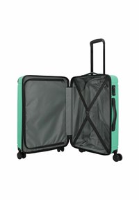 Hartschalenkoffer in Türkis, mit schwarzen Reißverschlüssen und Akzenten. Das Innere ist mit grauem Stoff ausgeschlagen, hat Kompressionsgurte und eine Reißverschlusstasche.