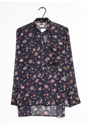 Chemise florale marine à manches longues et col boutonné. Comprend des motifs floraux multicolores, un tissu léger et un ourlet arrondi.