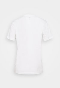 T-shirt blanc à manches courtes et col rond vu de dos, uni sans logos ni motifs visibles.