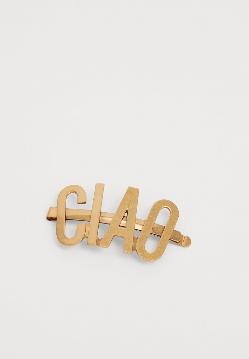 Gold-tone hair clip featuring the word “CIAO” in a bold, modern font. The clip has a sleek, polished finish with a flat shape.