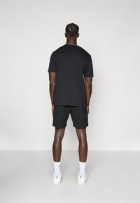 Champion C-TECH SHORTS - Kurze Sporthose - black