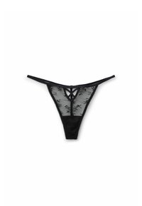String en dentelle noire avec un matériau transparent, motif floral, fines bretelles et une forme triangulaire. Présente des détails de bretelles croisées à l'avant.