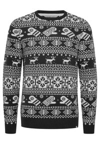 Schwarzer und weißer gemusterter Pullover mit Rundhalsausschnitt. Verfügt über geometrische Formen, Schneeflocken und Hirschmotive in einer gestrickten Textur.