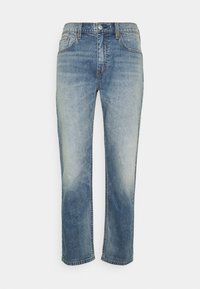 Jeans in denim azzurro chiaro con design a gamba dritta, dotati di due tasche frontali, lavaggio sbiadito e cuciture a contrasto lungo le cuciture.