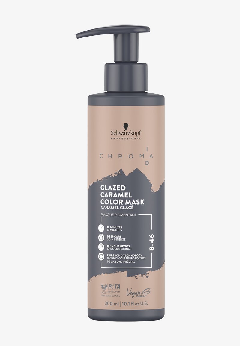 Schwarzkopf Chroma ID Glazed Caramel Color Mask in een cilindervormige, matte beige fles met een donkergrijze pomp, met productdetails in zwarte tekst.