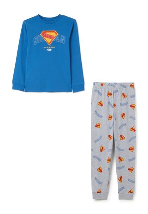 Blauwe longsleeve top en grijze broek set met herhaalde rode en gele Superman-logo's en tekstpatronen.