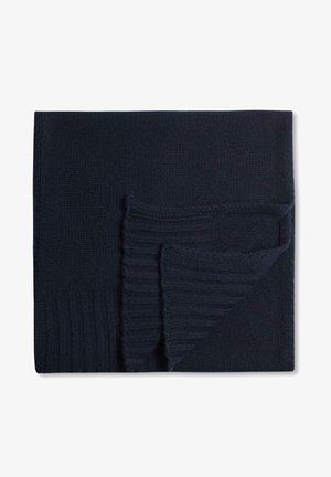Coperta lavorata a maglia blu navy con bordo a coste. La texture è morbida e accogliente, con una superficie liscia e un design a strati in un angolo.