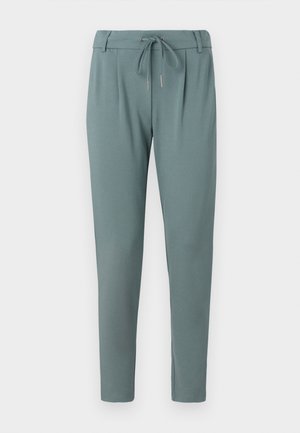 Ljus teal joggerbyxor i ett mjukt material, med elastisk midja och dragsko, avsmalnande ben och utan synliga mönster.
