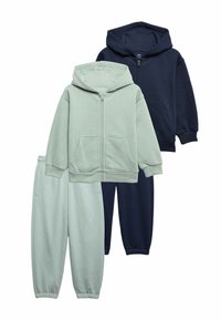 Two sets of kids' hooded zip-up sweatshirts and elastic-waist joggers in light green and navy blue, displayed on white background.