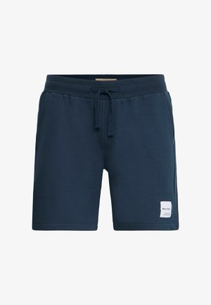 Tumši zili kokvilnas šorti ar ērtu elastīgu jostasvietu, aukliņu un sānu kabatām; tiem ir neliels balts logo uzlīme.