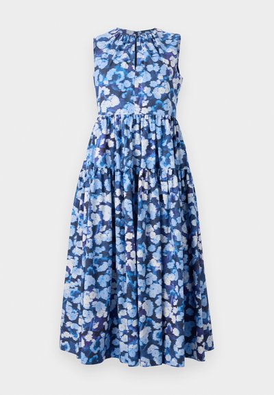 Floral maxi dress in blue tones, featuring a sleeveless design, gathered neckline, and tiered ruffle detailing. Made from lightweight fabric.