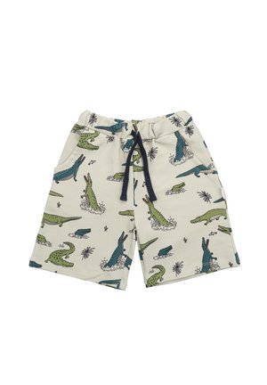 Shorts aus leichtem beigem Stoff mit einem Muster aus grünen und blauen Krokodilen. Elastischer Bund mit dunkelblauer Kordel. Zwei Seitentaschen.