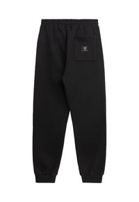 Sorte sweatpants laget av myk stoff, med en baklommepatch, elastisk midje og smalner nederst ved anklene.