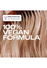 Capelli biondi chiari con un pettine marrone e testo che indica formula 100% vegana approvata da PETA senza ingredienti di origine animale.