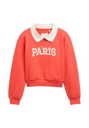 Coral cropped sweatshirt with a white collar. Features "PARIS" in bold, white text and "THE CITY OF LOVE" printed above in a smaller font.