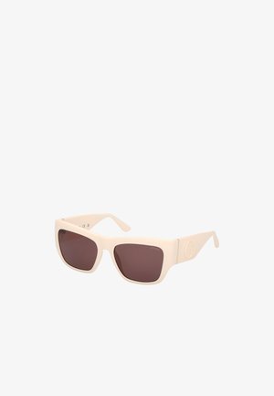 Beige square sunglasses with dark brown lenses. The frame is matte, crafted from plastic, featuring a subtle embossed logo on the side.
