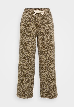 Pantaloni da tuta con stampa leopardata in una combinazione di colori beige e nera. Presentano una vita elastica con un cordino beige e gambe larghe. Realizzati in tessuto morbido.