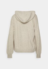 Hoodie en maille beige à manches longues, poignets côtelés et taille ajustée, vu de dos sur un fond neutre.