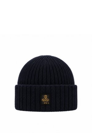 Berretto a coste blu navy scuro con risvolto e una piccola toppa rettangolare con il logo che presenta il contorno di un cane in oro.