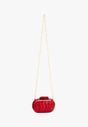 Red acrylic clutch bag with a rounded shape, smooth texture, and a gold chain strap. Features a top clasp and marbled finish.