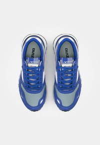Blue and gray athletic shoes with mesh and suede materials, featuring blue laces, black rubber soles, and a logo on the tongue.