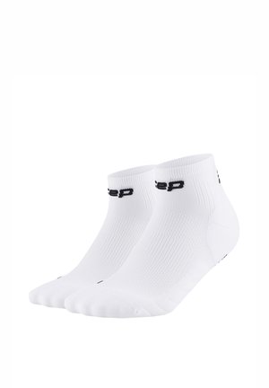 Pair of white ankle socks with black text logo on the cuff, ribbed texture, and reinforced heel and toe areas.