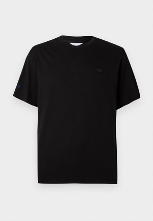 Svart bomulls t-skjorte med rund hals, korte ermer og subtil logo broderi på brystet og ermet i svart og blått.
