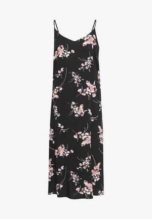 Robe noire à fleurs avec des bretelles fines, arborant un motif de fleurs roses et des accents verts. Tissu léger, forme évasée, coupe au niveau des genoux.