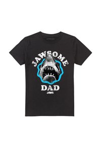 Black cotton T-shirt featuring a large graphic of a shark's open mouth. Text reads "JAWSOME DAD" in white, with blue accents.