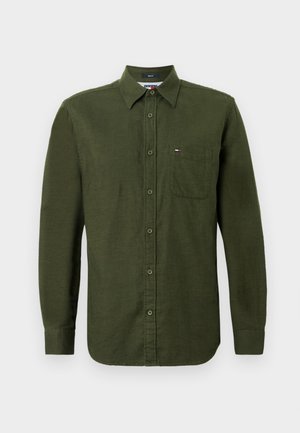 Vihreä napitettupaita pitkillä hihoilla, valmistettu tekstuuripinnasta. Sisältää rintataskun ja pienen logo rinnassa.