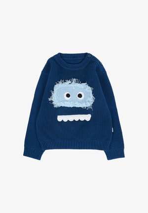 Maglione blu lavorato a maglia con texture a coste, caratterizzato da una morbida toppa azzurra con grandi occhi bianchi e un dettaglio della bocca bianca a scallop.