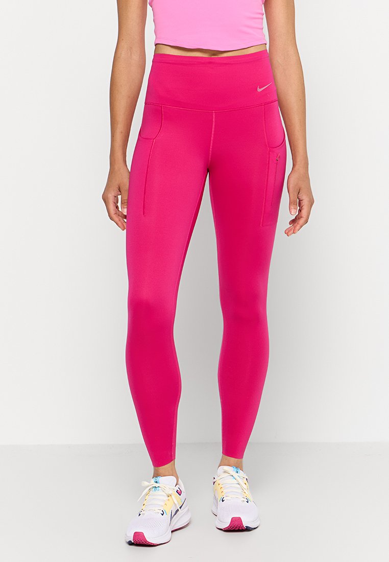 Leggings rosa a vita alta, aderenti, con tasche laterali, realizzati in materiale liscio e elasticizzato, con un discreto dettaglio del logo.
