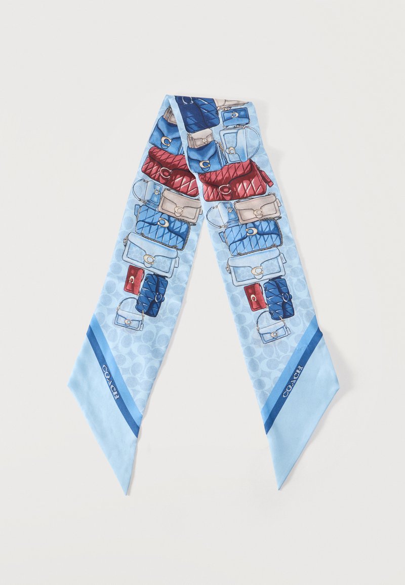 Ανοιχτό μπλε μεταξωτό μαντήλι με πολύχρωμες εικονογραφήσεις τσαντών και σκούρες μπλε περιμετρικές λεπτομέρειες με την ετικέτα "Coach".