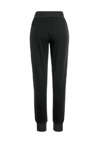 Schwarze Jogginghosen aus weichem Stoff, mit elastischem Bündchen und Säumen, in schmaler Silhouette und ohne auffällige Muster.