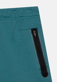 Nike Sportswear UNISEX - Teplákové kalhoty - mineral teal/black