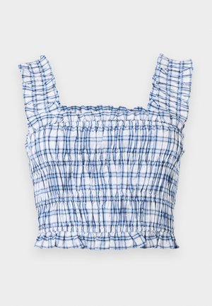 Κορυφή κοντή με καρό σχέδιο σε μπλε και λευκό, με βολάν στους ιμάντες, ραμμένη με λάστιχο στο σώμα και φραμπαλά στο τελείωμα, απλωμένη επίπεδη σε ανοιχτό φόντο.