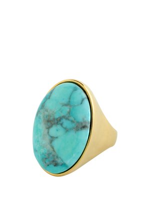 Gold ring with a large oval turquoise stone featuring natural gray veining, set on a smooth band.