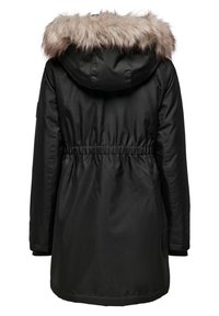 Svart jacka med huva kantad med päls, elastisk midja och ribbade ärmmuddar. Slät textur med knä-lång design och inga synliga knäppningar.