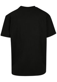 T-shirt noir en coton, avec un design simple et classique à col rond, des manches courtes et une coupe droite, sans graphismes ni motifs.