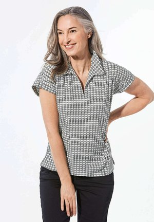 Poloshirt mit kurzen Ärmeln und geometrischem Schwarz-Weiß-Muster, mit kragenlosen Ausschnitt und entspannter Passform. Strukturierter Stoff.