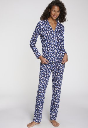 Navy blue pajama set with a patterned design of white and light blue irregular shapes. Long-sleeved top and matching trousers, soft fabric.