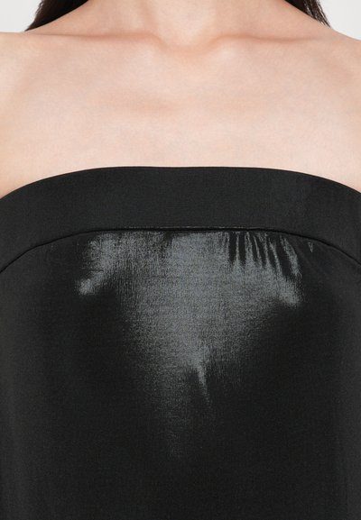 Black strapless top featuring a smooth, shiny texture and a structured neckline. The fabric appears sleek and minimalistic.