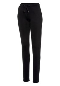 Schwarze Jogginghosen aus weichem Stoff, mit einem elastischen Bund und einem Kordelzug, seitlichen Taschen und schmal zulaufenden Beinen.