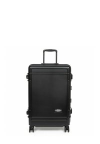 Black hard-shell suitcase with a telescopic handle, four wheels, and a logo. Smooth texture, rectangular shape, featuring minimalistic design.