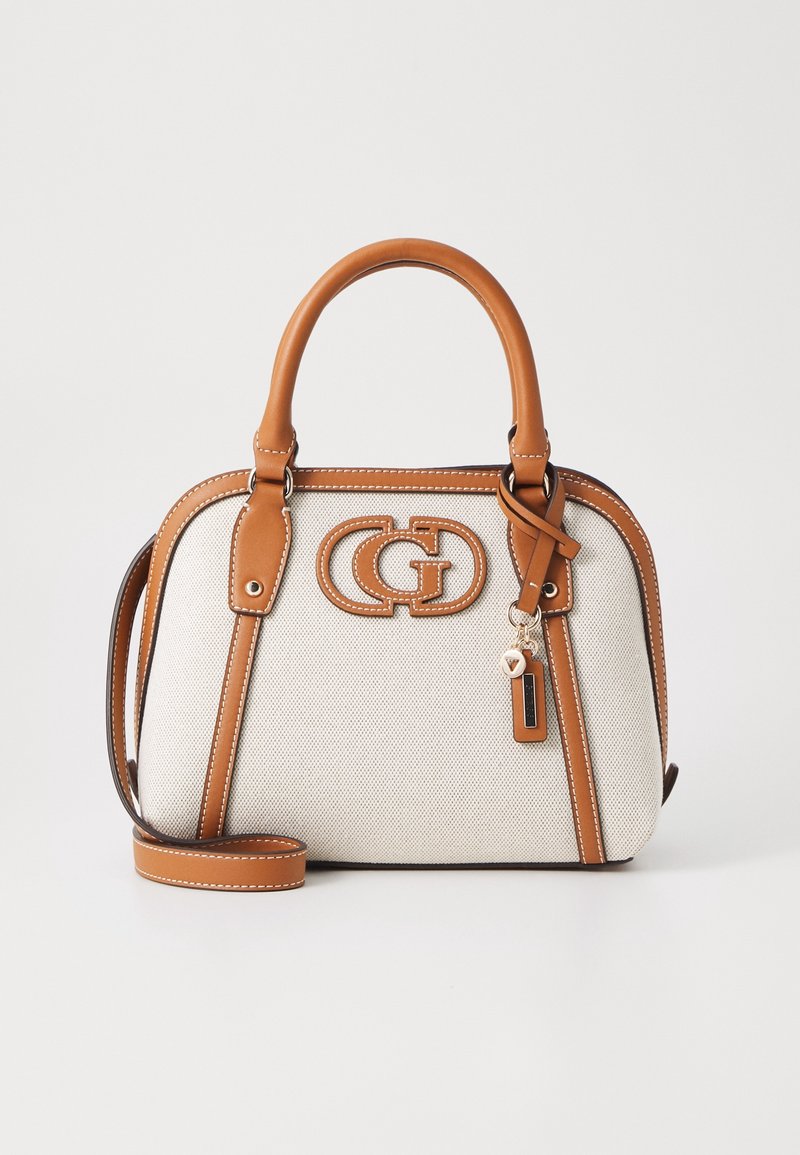 Sac à main en tissu beige avec poignées en cuir marron clair, garniture, bandoulière et un logo double-G décoratif sur le devant.