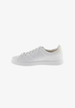 White sneaker with smooth synthetic upper, perforated design on sides, and textured white heel accent. Rubber sole with a low profile.